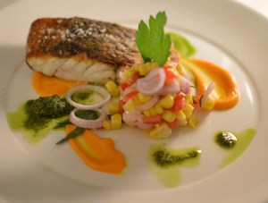 Roasted Cone Bay barramundi w carrot puree, sweet corn, eschalot, tarragon salad & rocket pesto