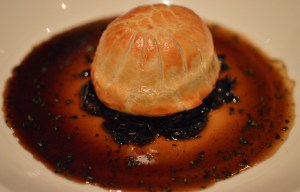 Braised lamb pie w garlic, mushrooms & tarragon jus