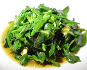 Stir-fried 'Coorong' Beach banana succulent w bower spinach, munyeroo w biodynamic garlic