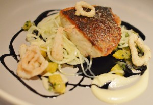 Pan seared Palmers Island Mulloway, calamari rings, confit potato noodles, orange, chive & squid ink dressing