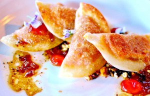 Pumpkin pot stickers on crispy puffed grains w baby leaves & nasturtium gel